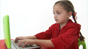 Eight year old girl surfing the Web