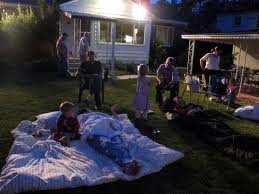 summer backyard family reunion kids on mattress